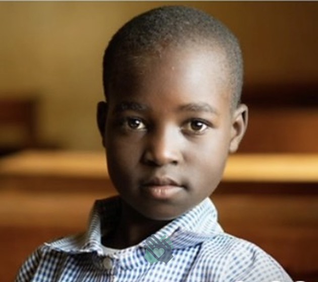 A schoolboy supported by USMIO education programs